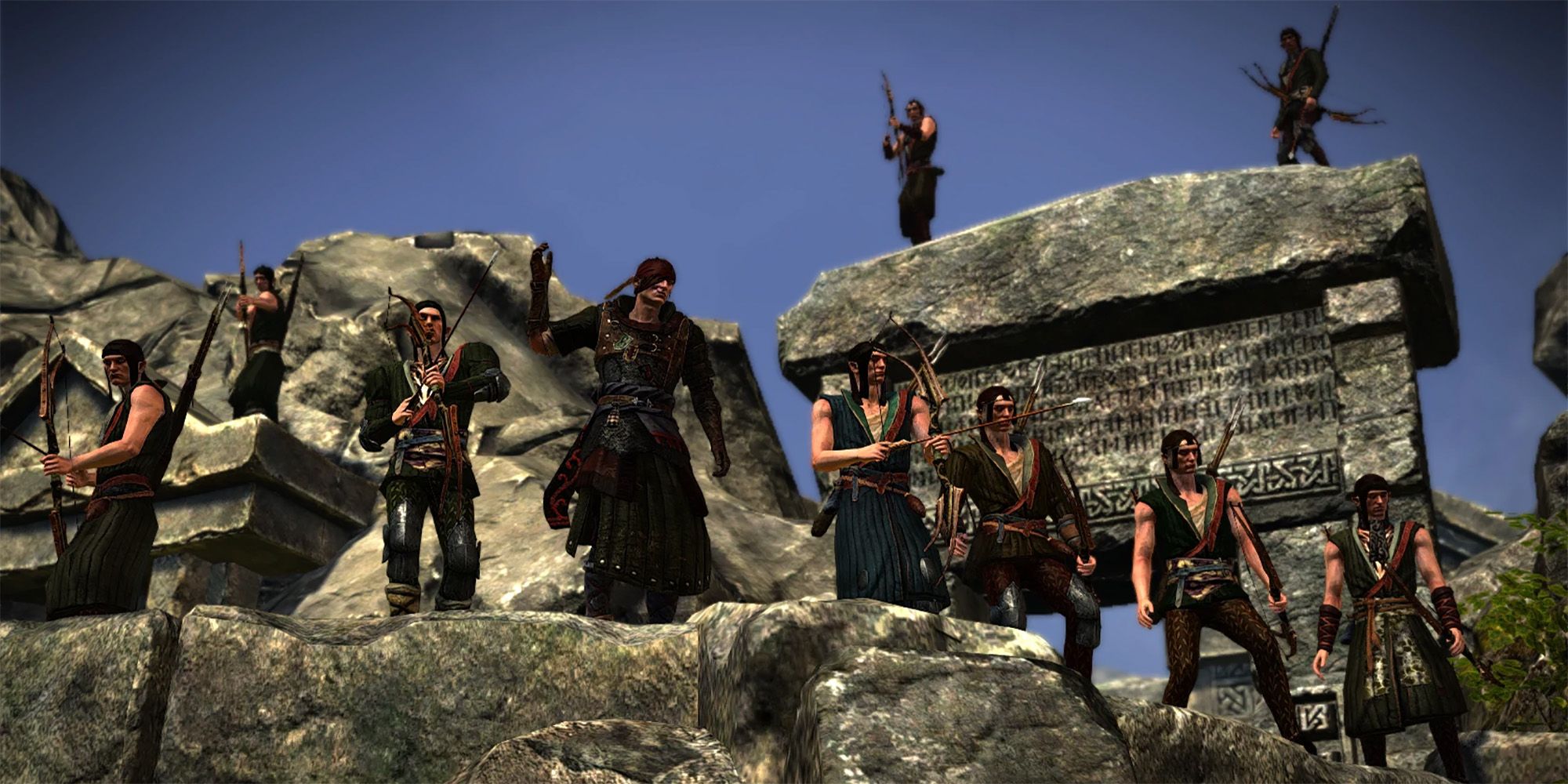The Scoia'tael standing in a row on a rock fortification in The Witcher 2
