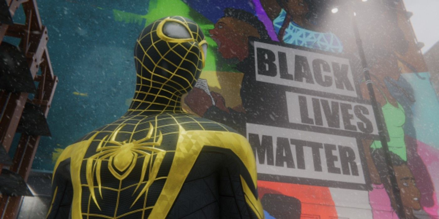 MIles standing in front of a BLM monument in his Uptown Pride suit in Spider-Man: Miles Morales for the PlayStation