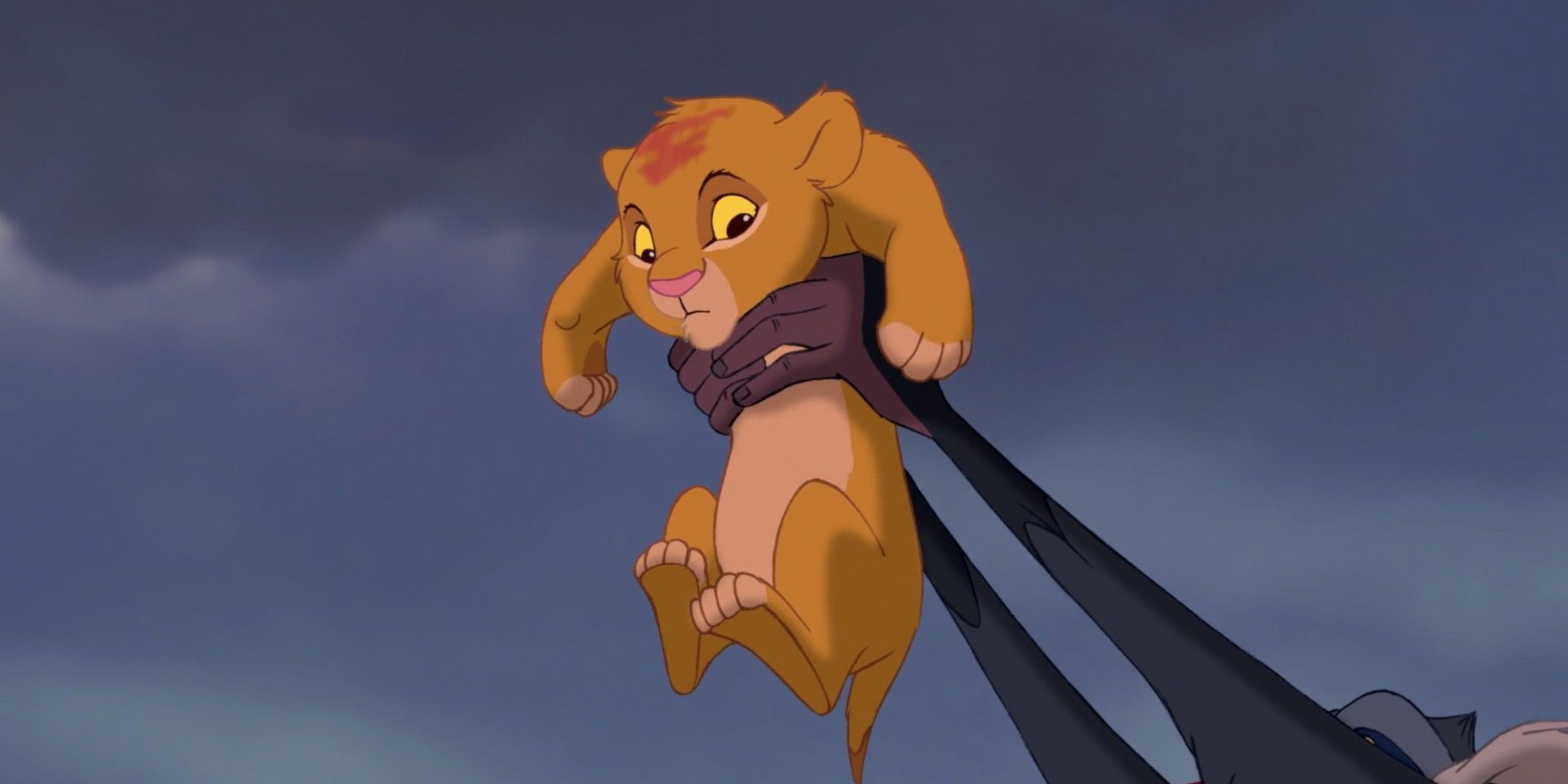 Closeup of Rafiki holding up baby Simba in the Disney film The Lion King