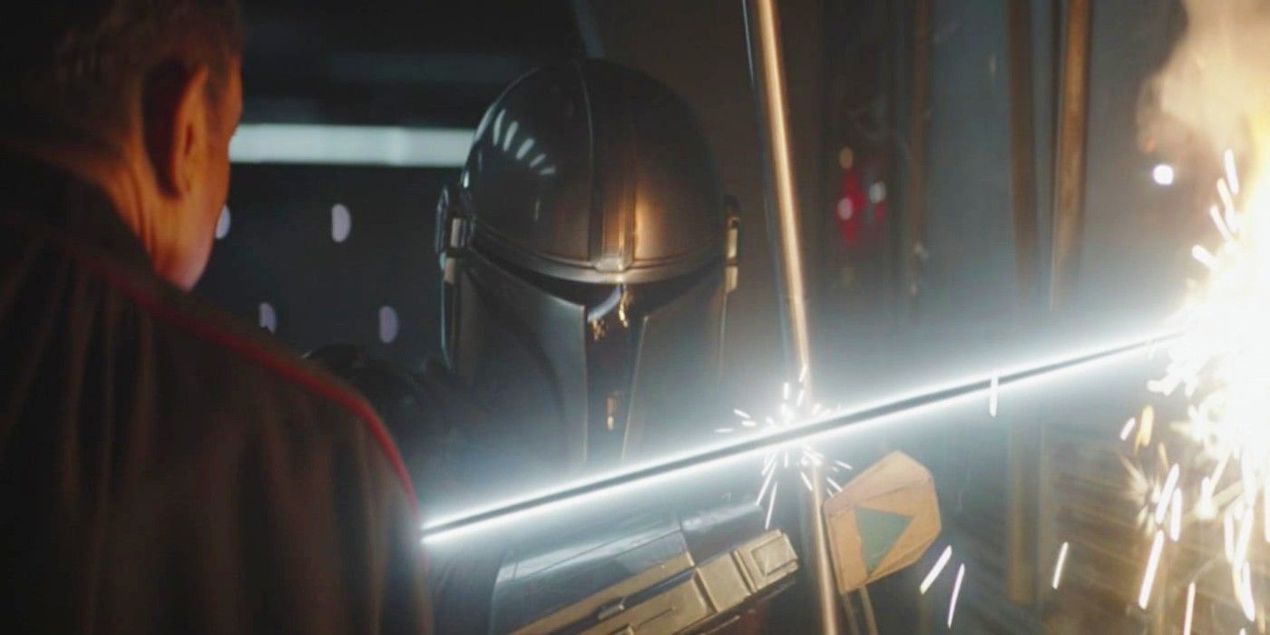 Din Djarin fighting against the Darksaber in The Mandalorian Season 2 finale