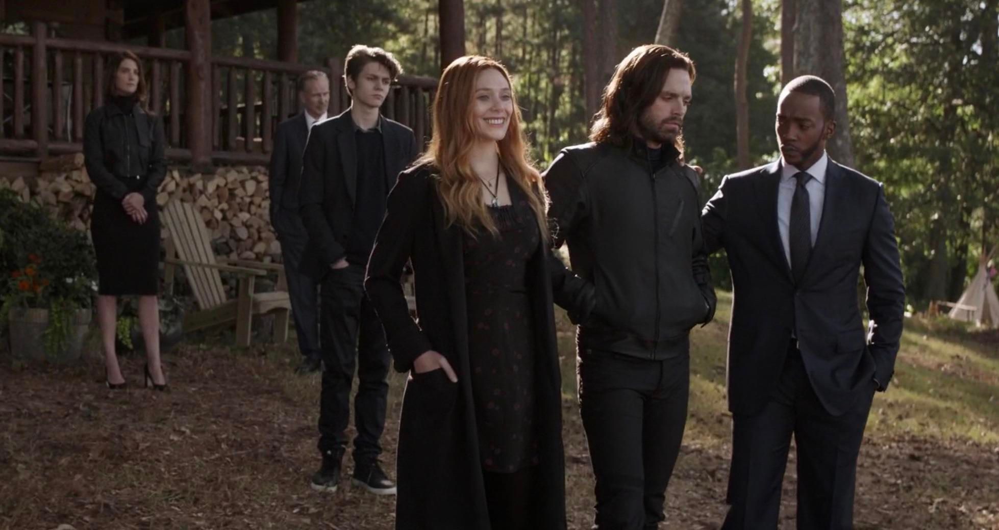 scarlet witch smiles at iron mans funeral