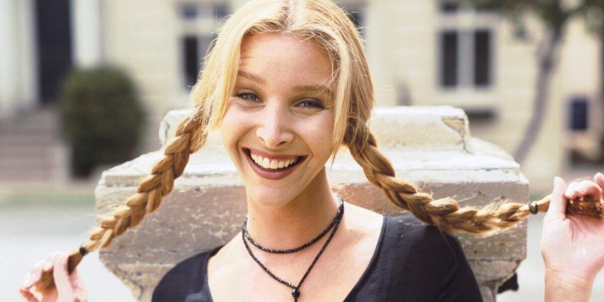 Phoebe Buffay lifting her braids out and smiling on the street
