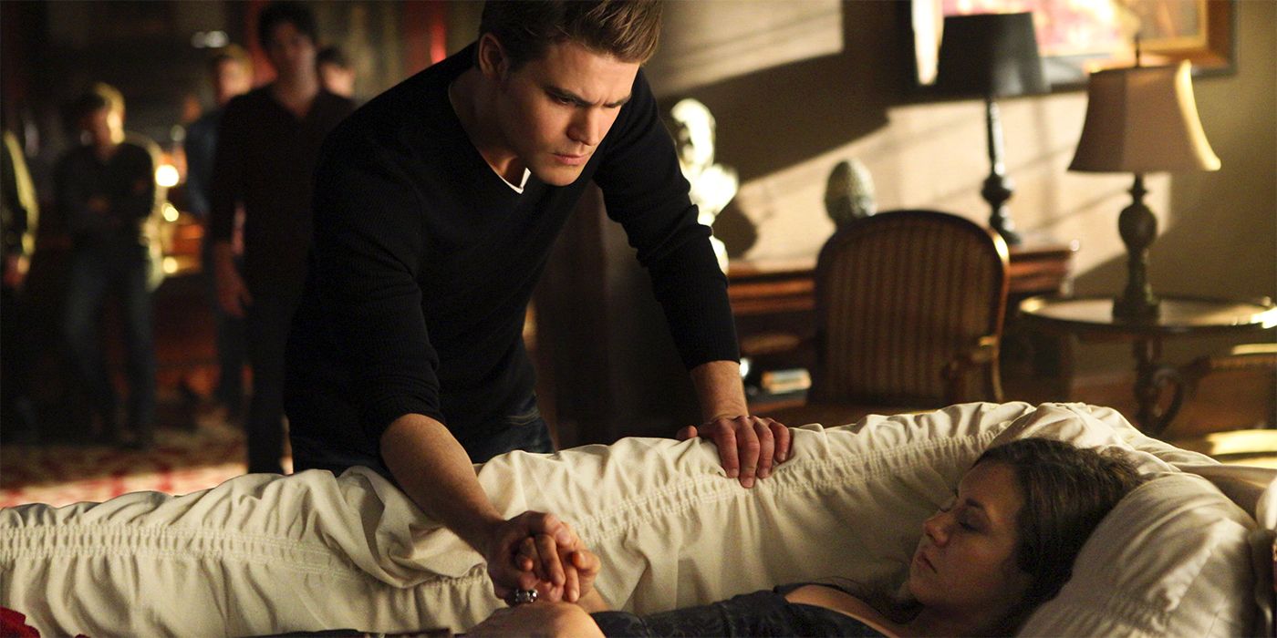 Stefan (Paul Wesley) looking at Elena (Nina Dobrev)'s body in a casket on The Vampire Diaries