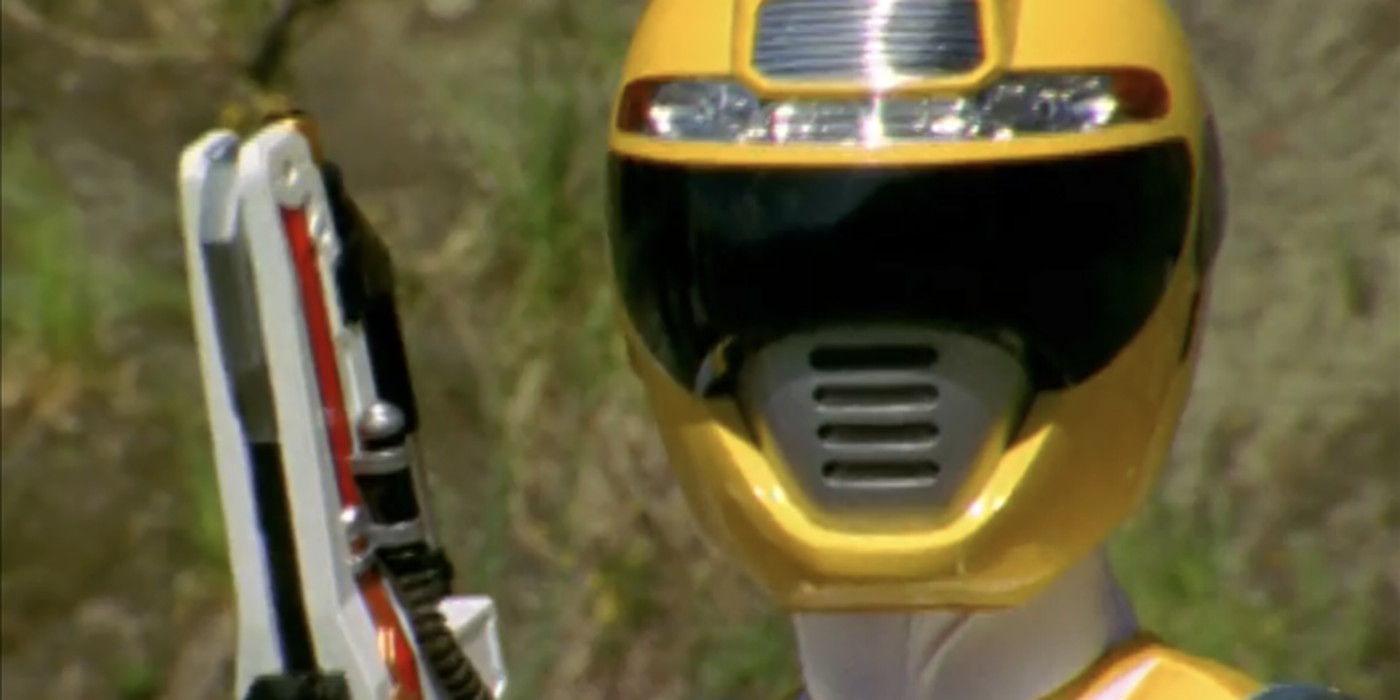 Ronny, the Yellow Ranger in Power Rangers Operation Overdrive, wielding his weapon in battle