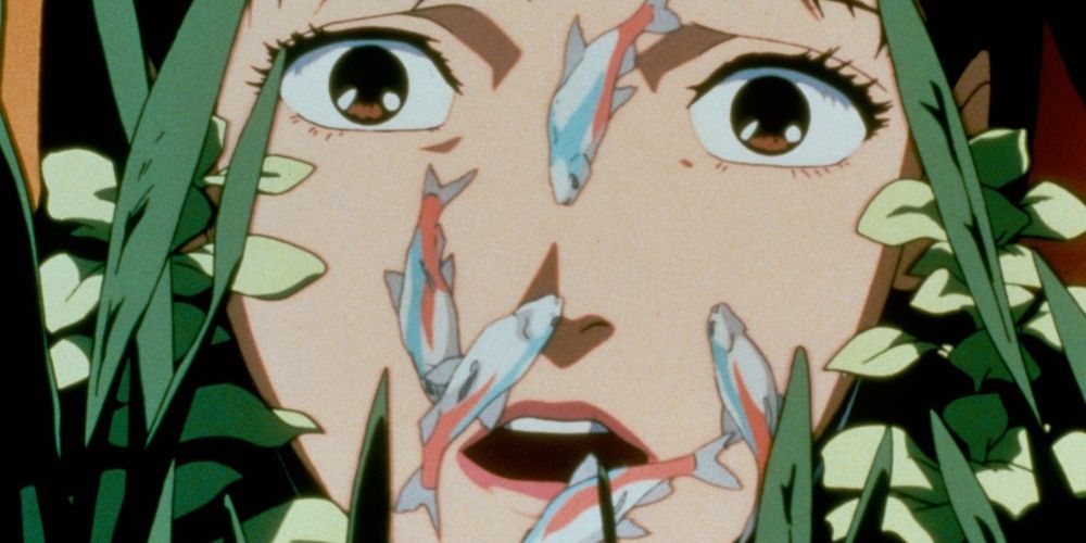 Mimi gazes in awe at some fish in Perfect Blue.