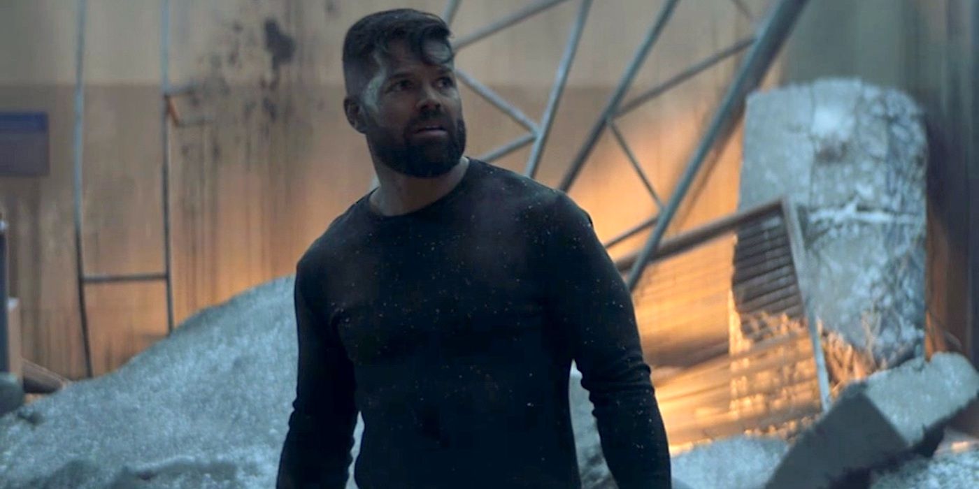 Wes Chatham as Amos Burton surrounded by rubble in The Expanse.