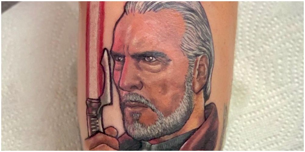 Count Dooku looking at his lightsaber