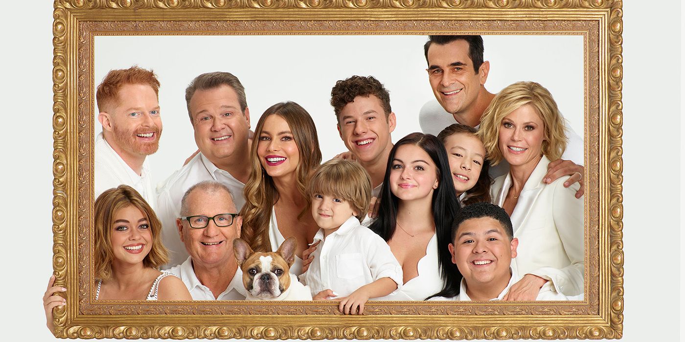 Portrait of the cast of Modern Family smiling 
