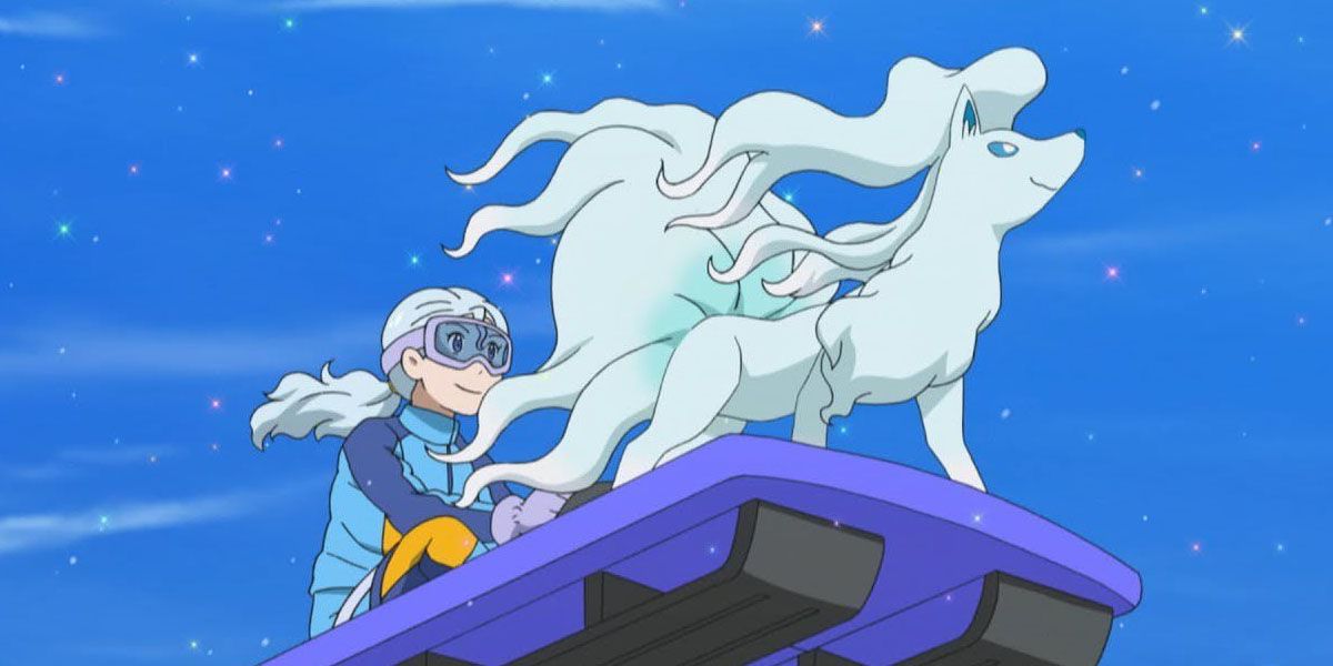 Pokemon Ninetales goes sledding with a trainer.