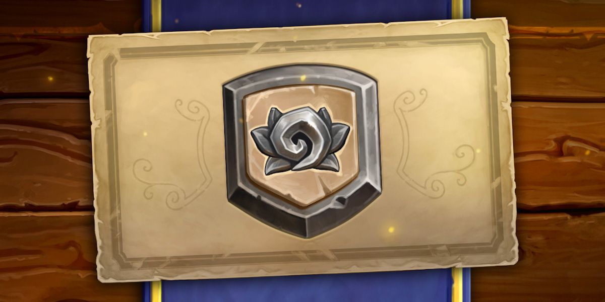 A silver emblem with the Hearthstone Logo