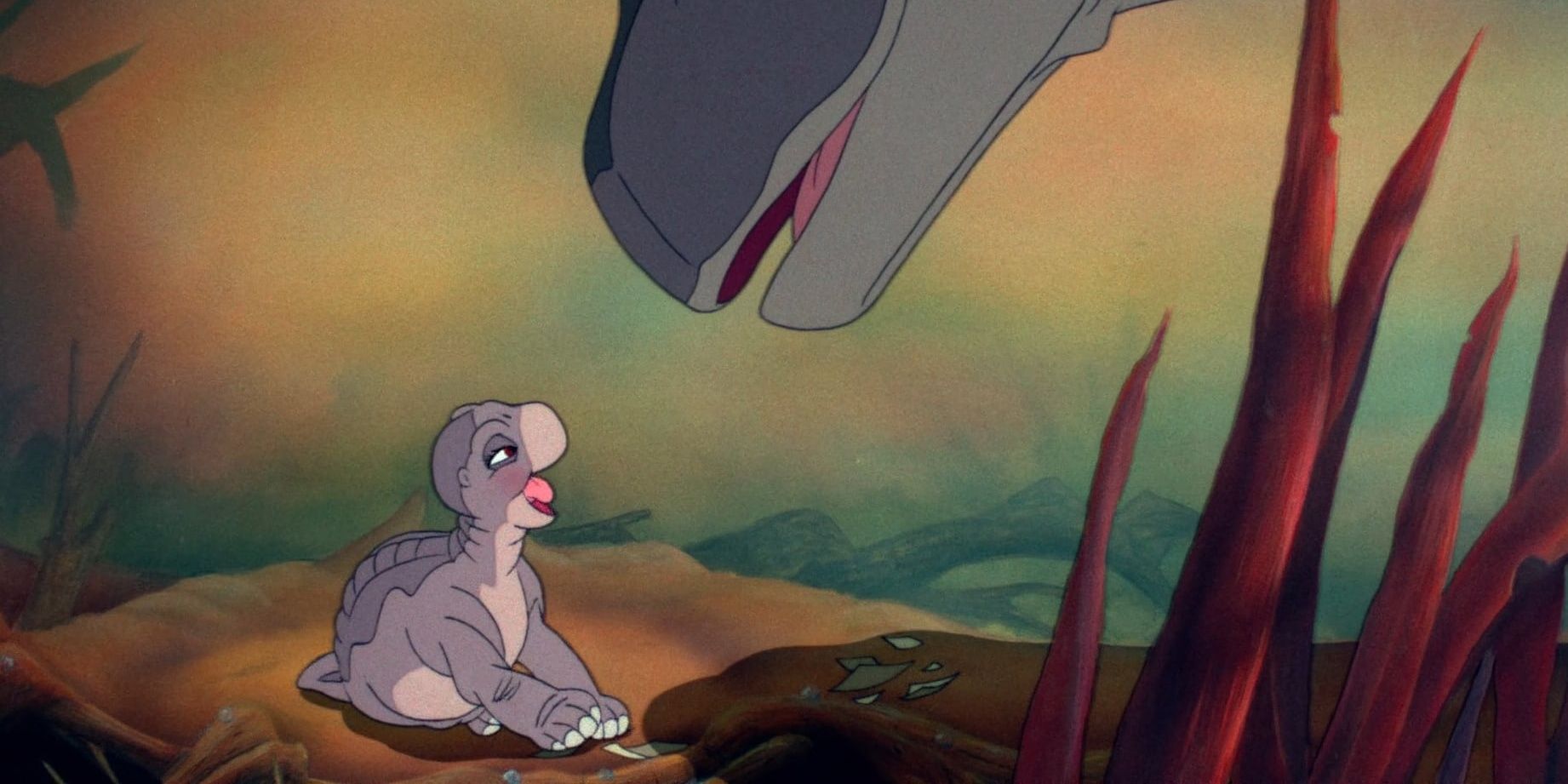 Littlefoot's mother smiling and Littlefoot in The Land Before Time