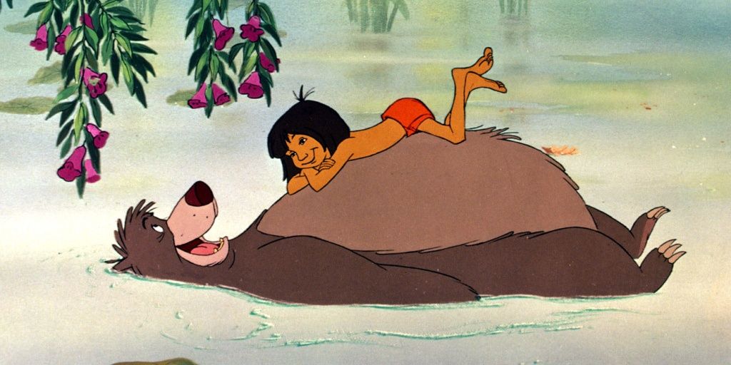 Mowgli and Baloo swimming on the river in The Jungle Book Cropped