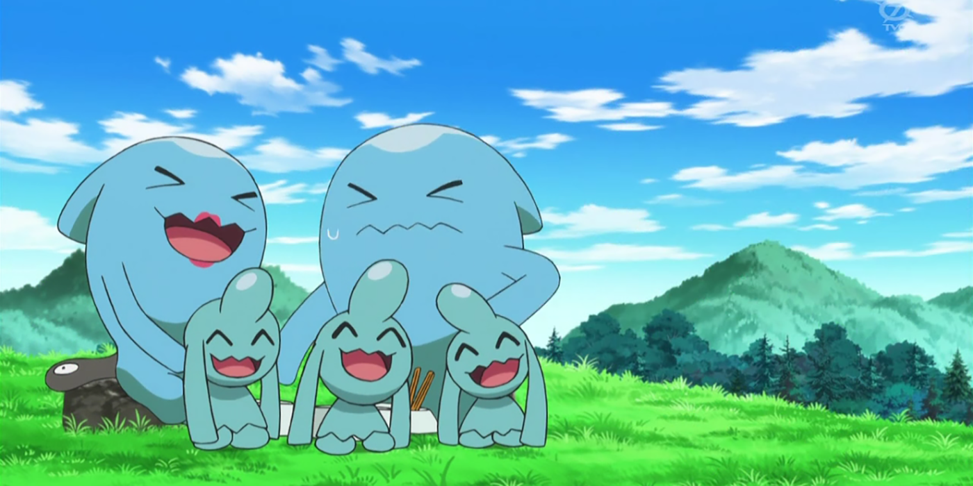 Wobbuffet with Wynaut in a grassy field in the Pokemon anime