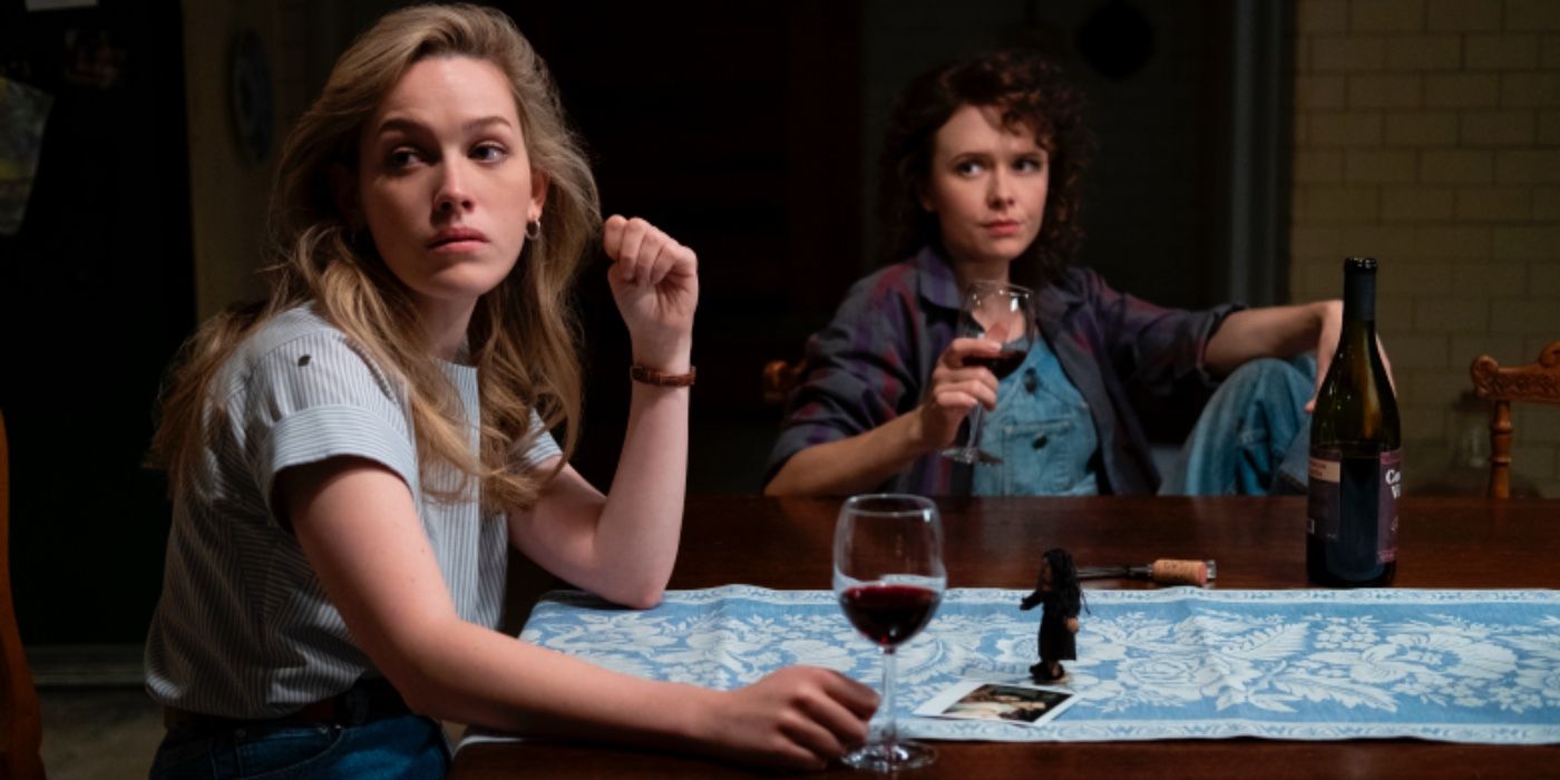 Dani and Jamie drinking wine at the table in the Haunting of Bly Manor