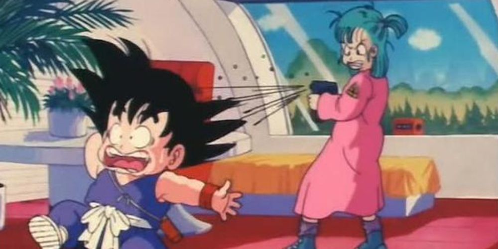 Bulma shoots Kid Goku in Dragon Ball.