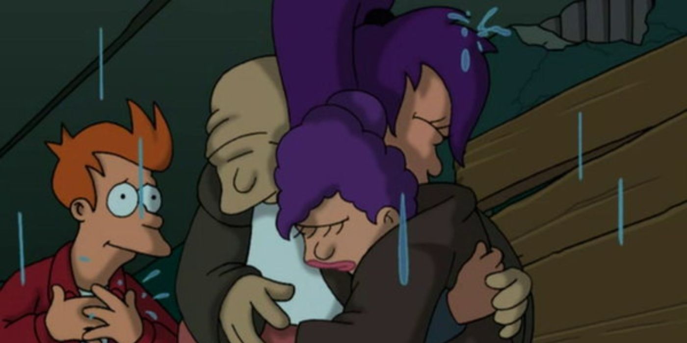 Leela embraces her parents as Fry watches, touched by the moment.