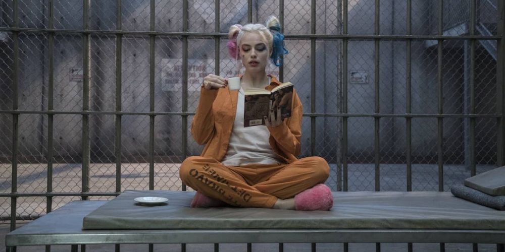 Harley Quinn sips espresso and reads at the end of Suicide Squad