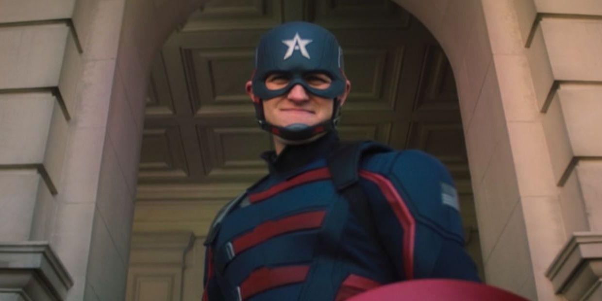 John Walker in Captain America attire smiling at someone in The Falcon and the Winter Soldier