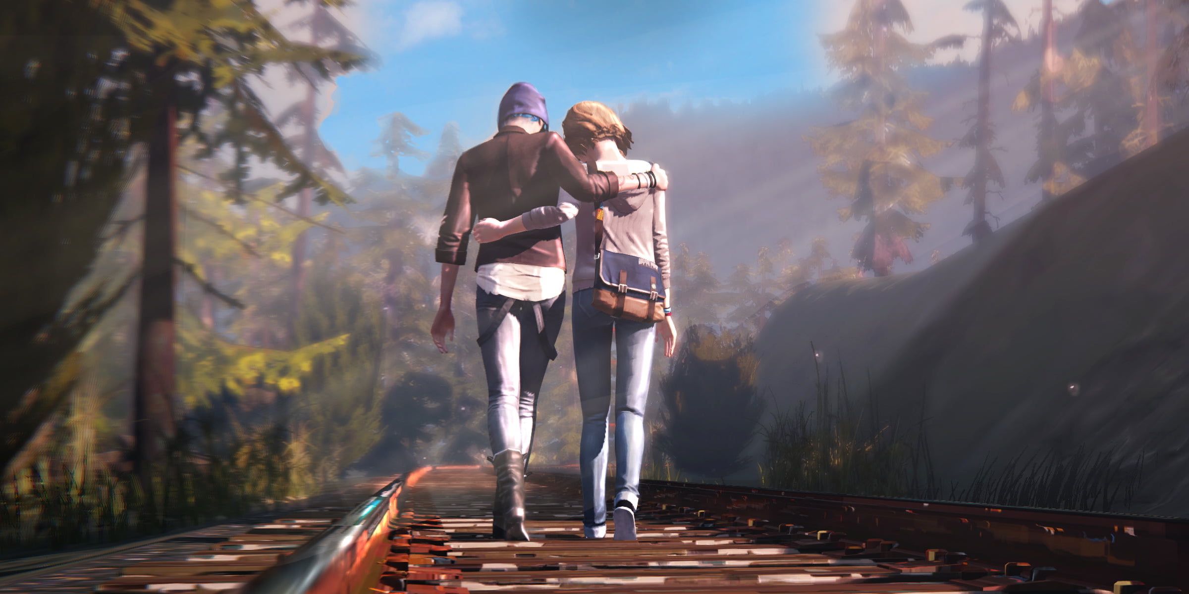 Chloe and Max walking along a railway track in the middle of a forest
