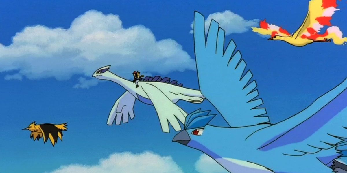 The legendary birds soar peacefully in the air with Ash riding Lugia in Pokemon the Movie 2000