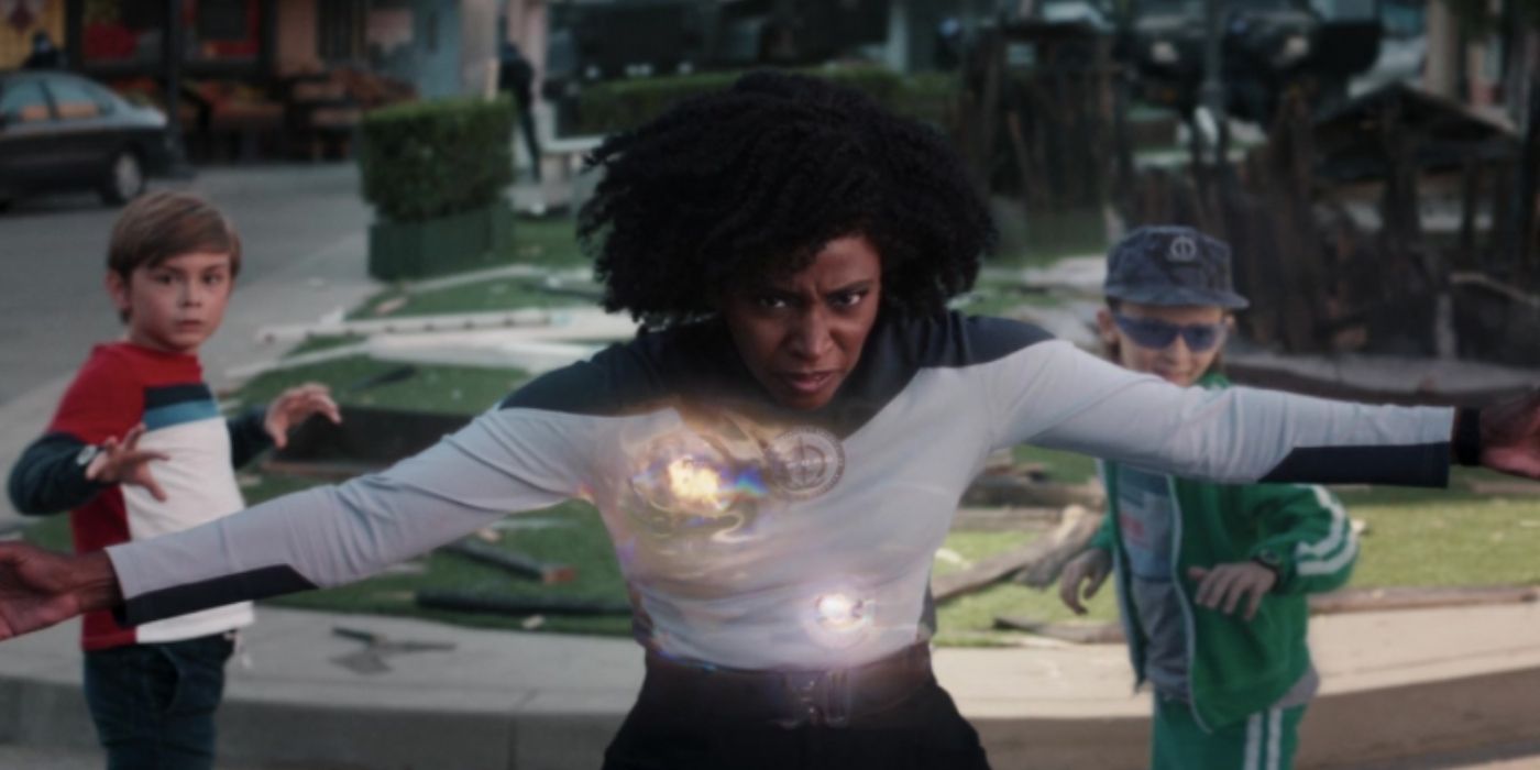 A costumed Monica Rambeau stands in front of the Scarlet Witch's sons