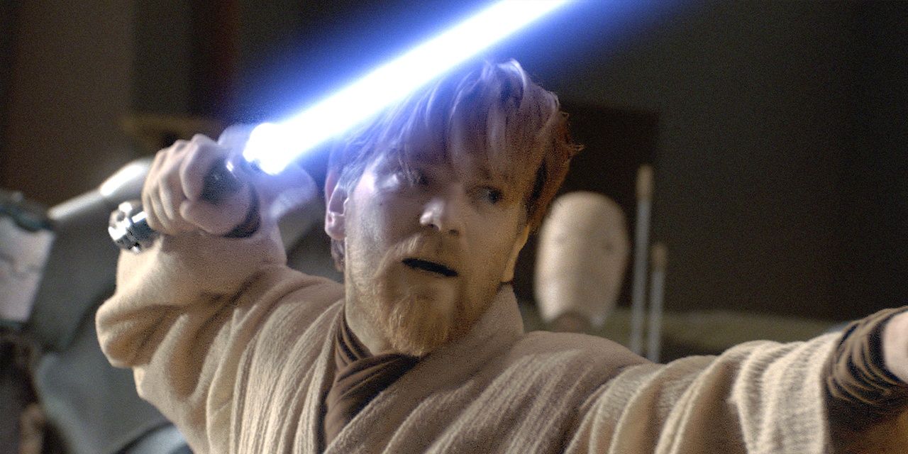 Obi Wan Kenobi with lightsaber raised and ready to battle from Episode III.