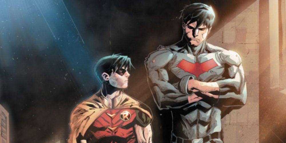 Jason Todd as Red Hood and Robin standing next to each other.