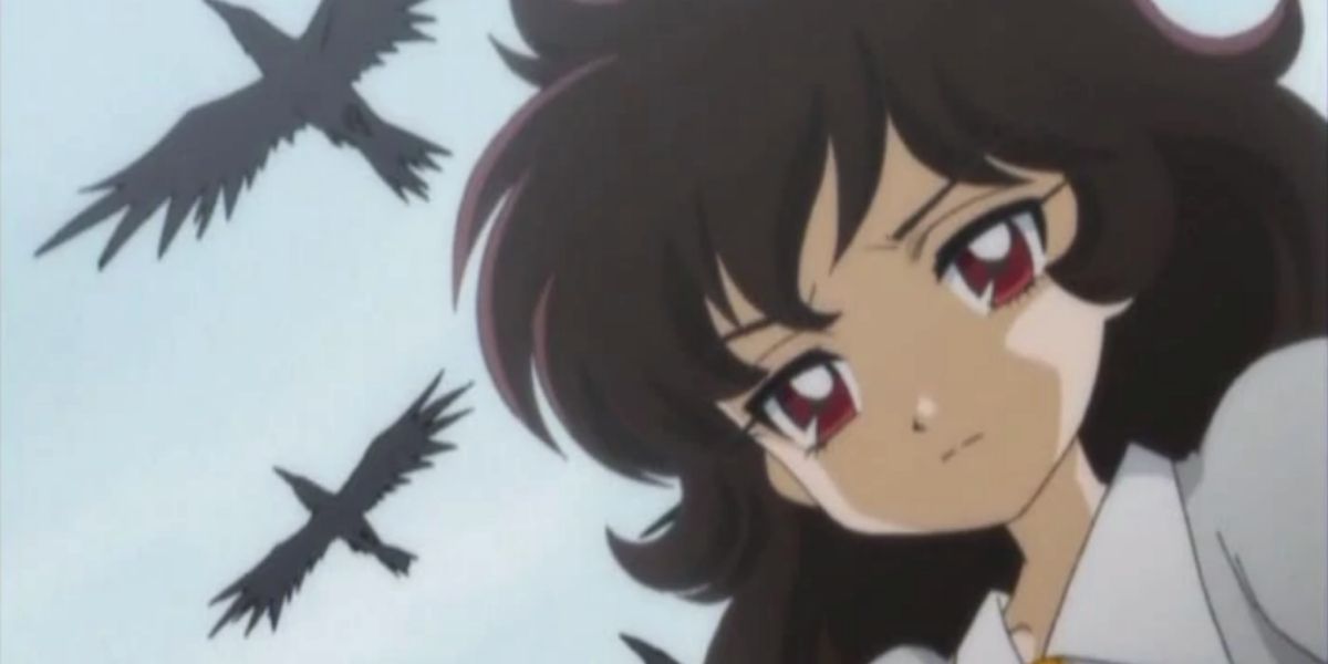 Rue walking as a pair of crows follow her above in Princess Tutu.