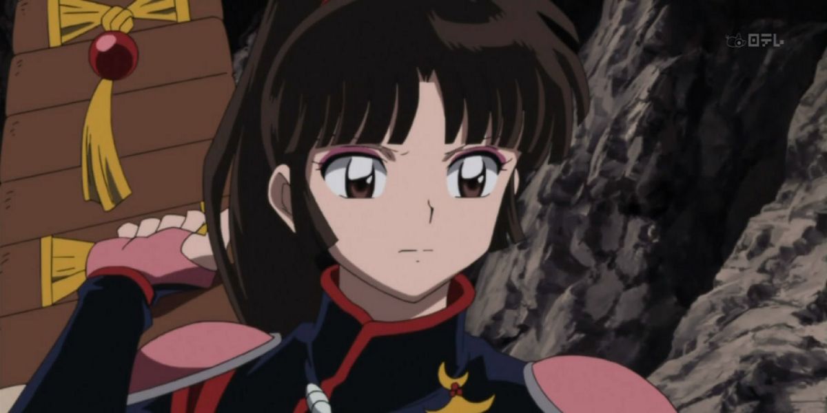 Sango holding her Hiraikotsu against her back in Inuyasha.