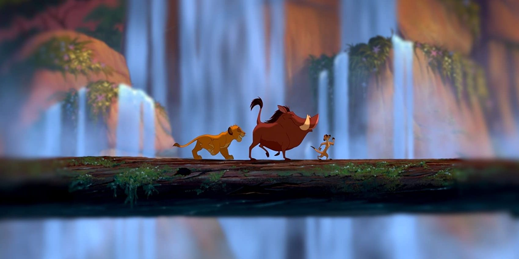 Timon, Pumbaa, and Simba walking over a tree trunk during "Hakuna Matata" in The Lion King