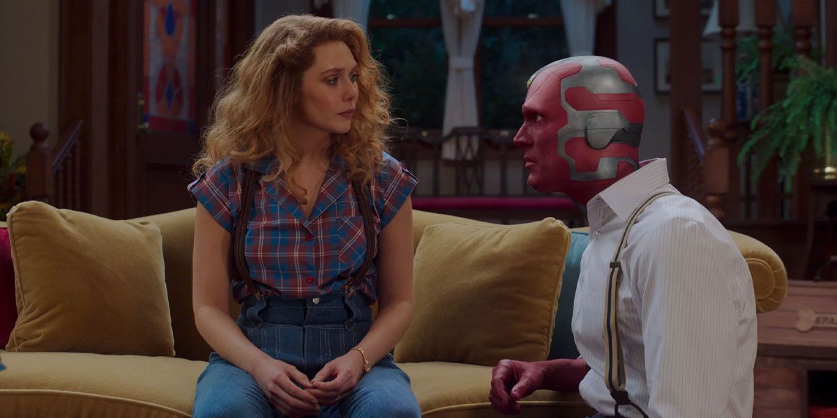 Vision kneels down as he confronts Wanda