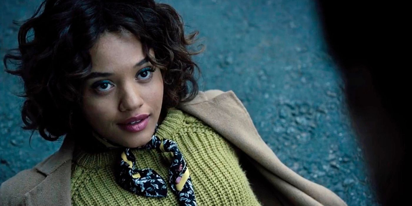 Kiersey Clemons' Iris West smiles after being rescued by the Flash