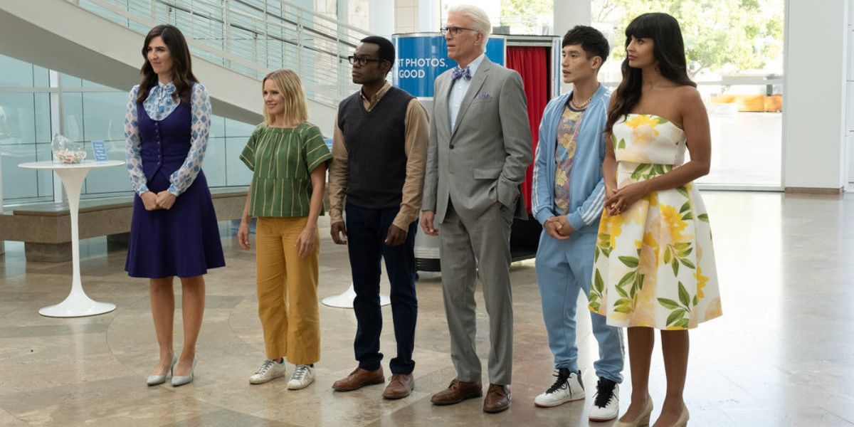 Characters from The Good Place standing in the Bad Place.