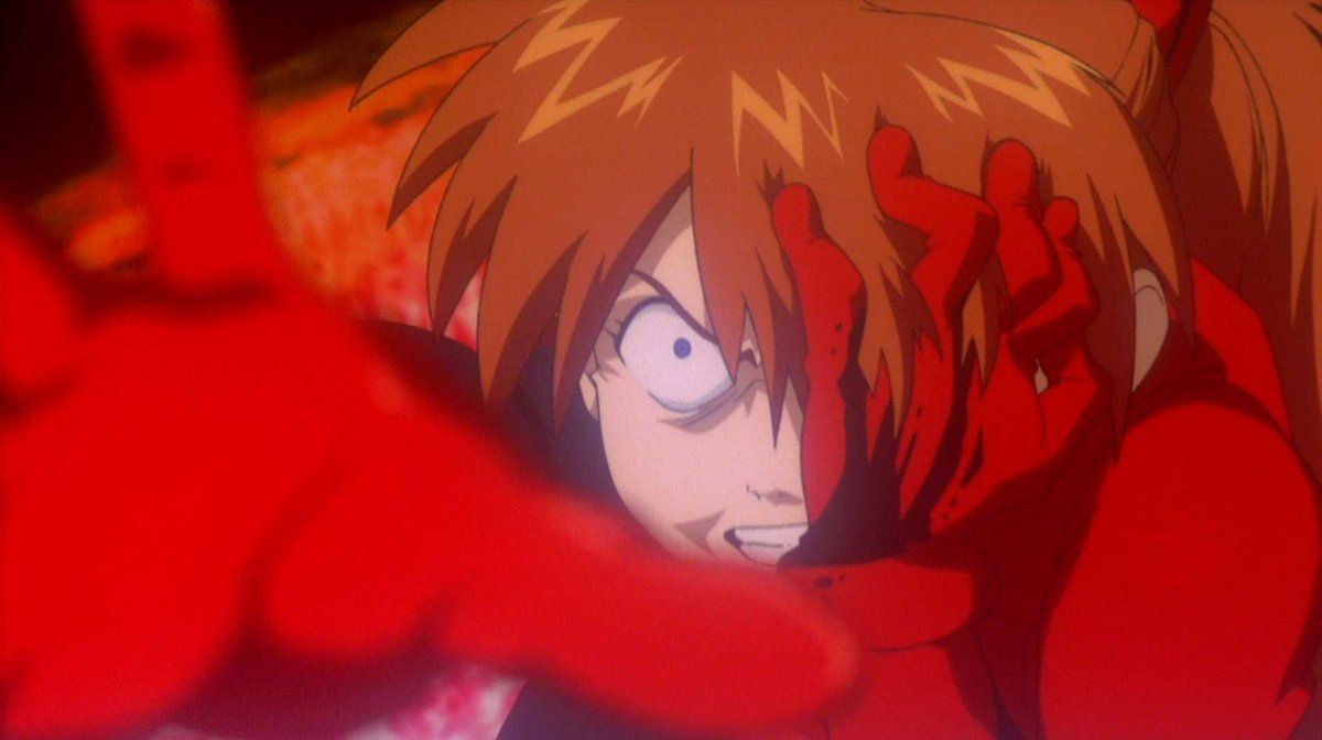 Asuka struggles to fight back against the Angel's infection in Neon Genesis Evangelion