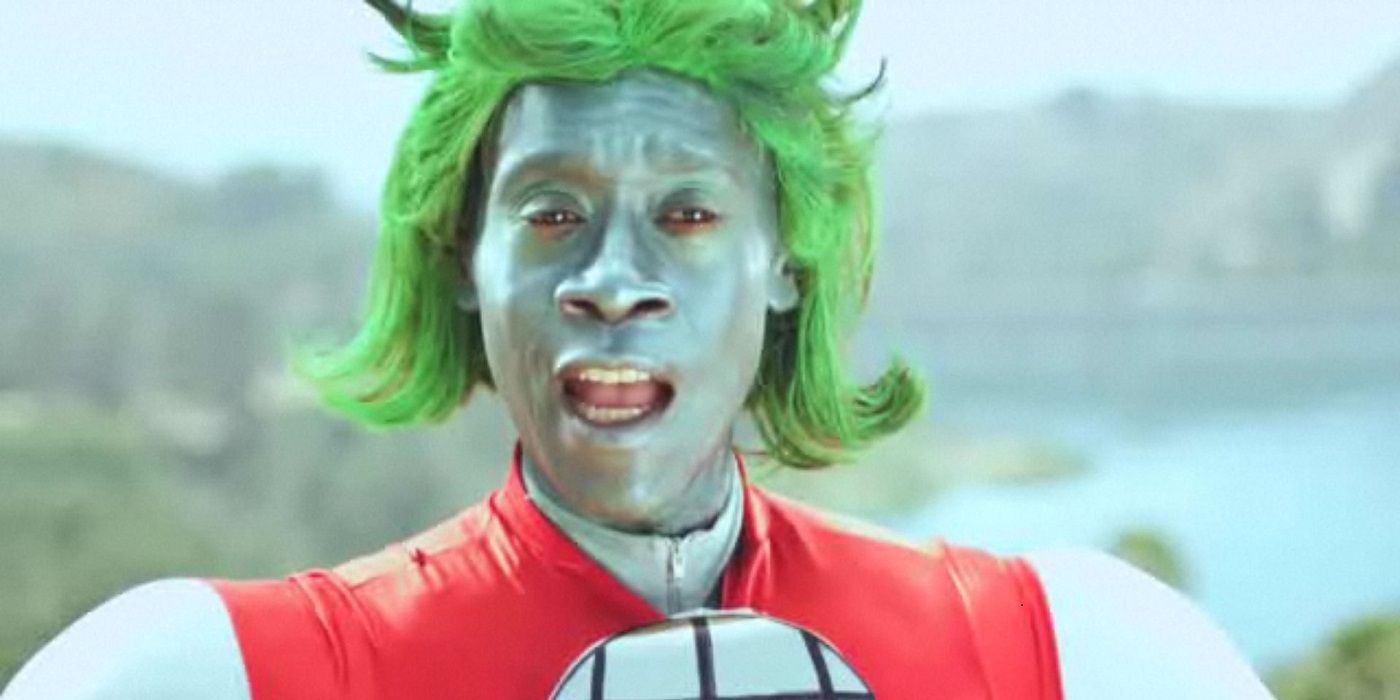 Don Cheadle's Captain Planet is in mid-sentence, stood in front of some greenery