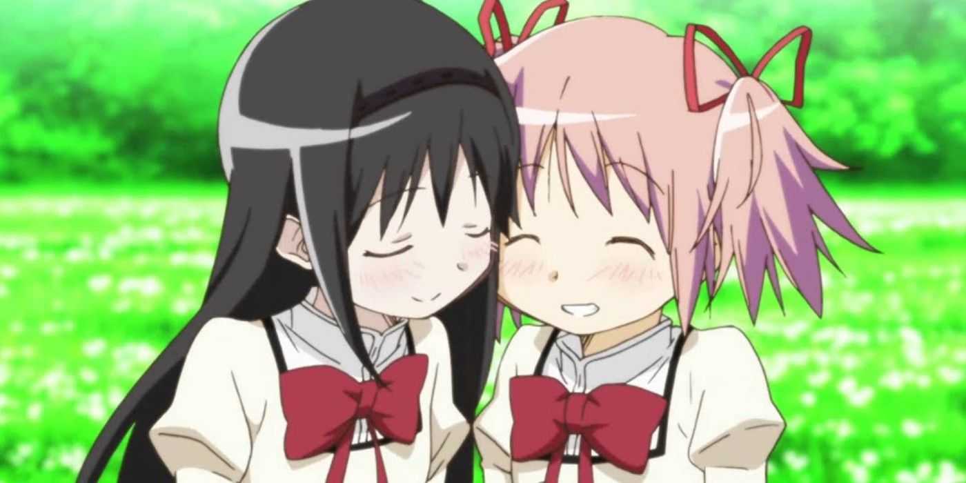 Homura and Madoka cuddle in a scene from the Madoka Magica Movies.
