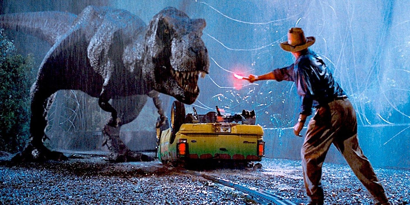 Alan Grant waves a flare to distract a T-Rex in Jurassic Park