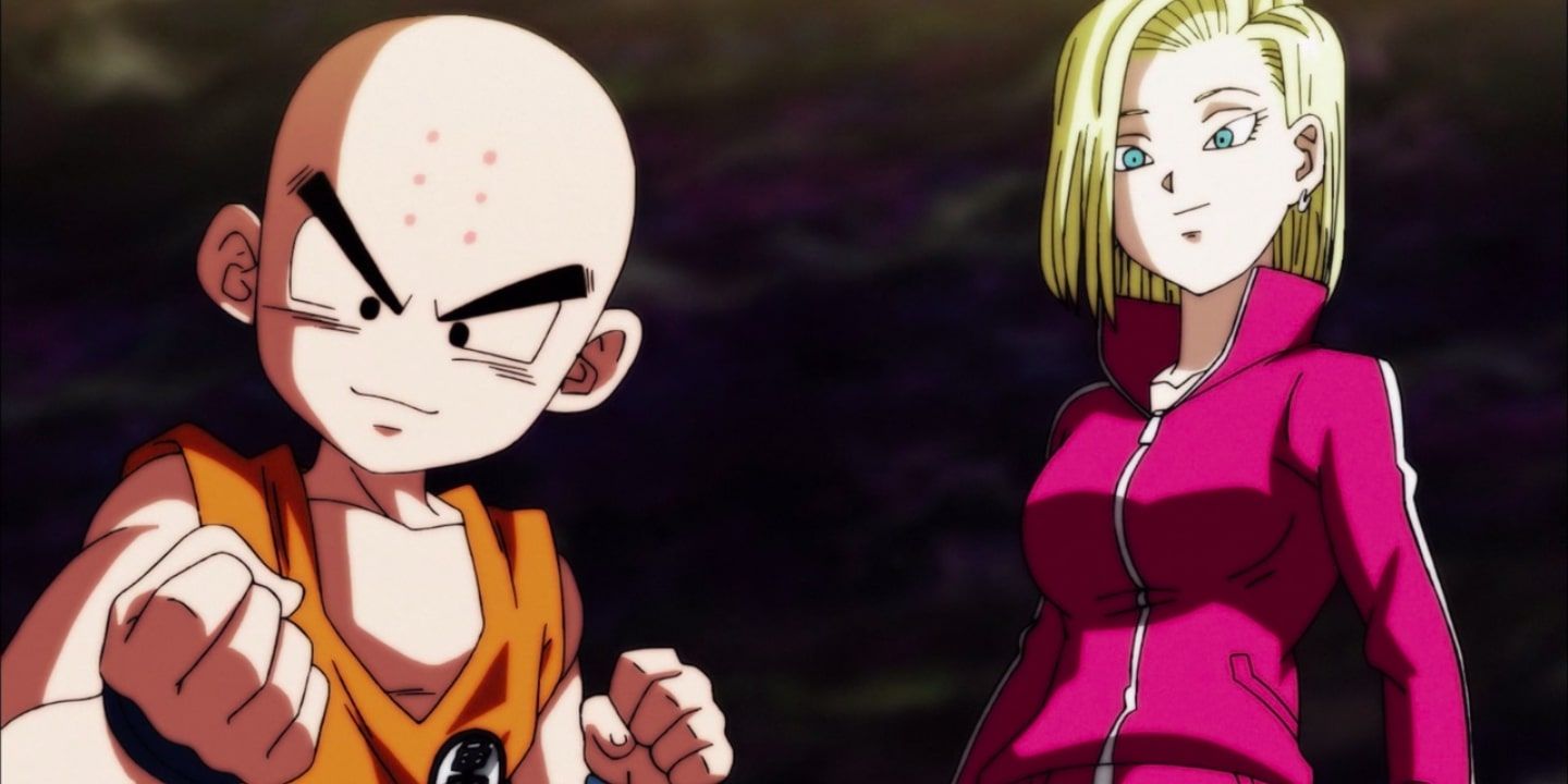 Krillin looking determined and Android 18 looking at him fondly in Dragon Ball Super.