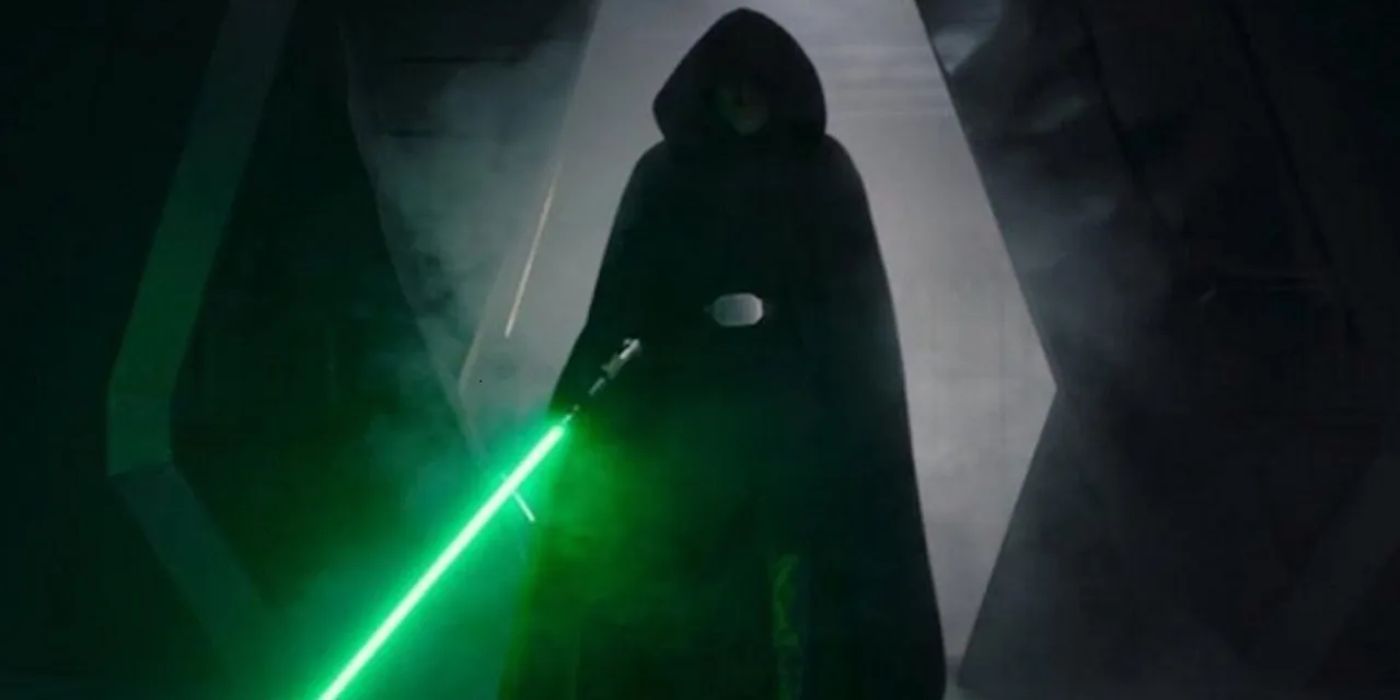 Luke Skywalker holds his lightsaber ready for battle with his hood up
