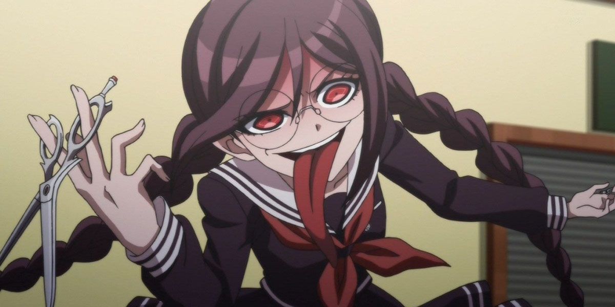 Toko with a pair of scissors