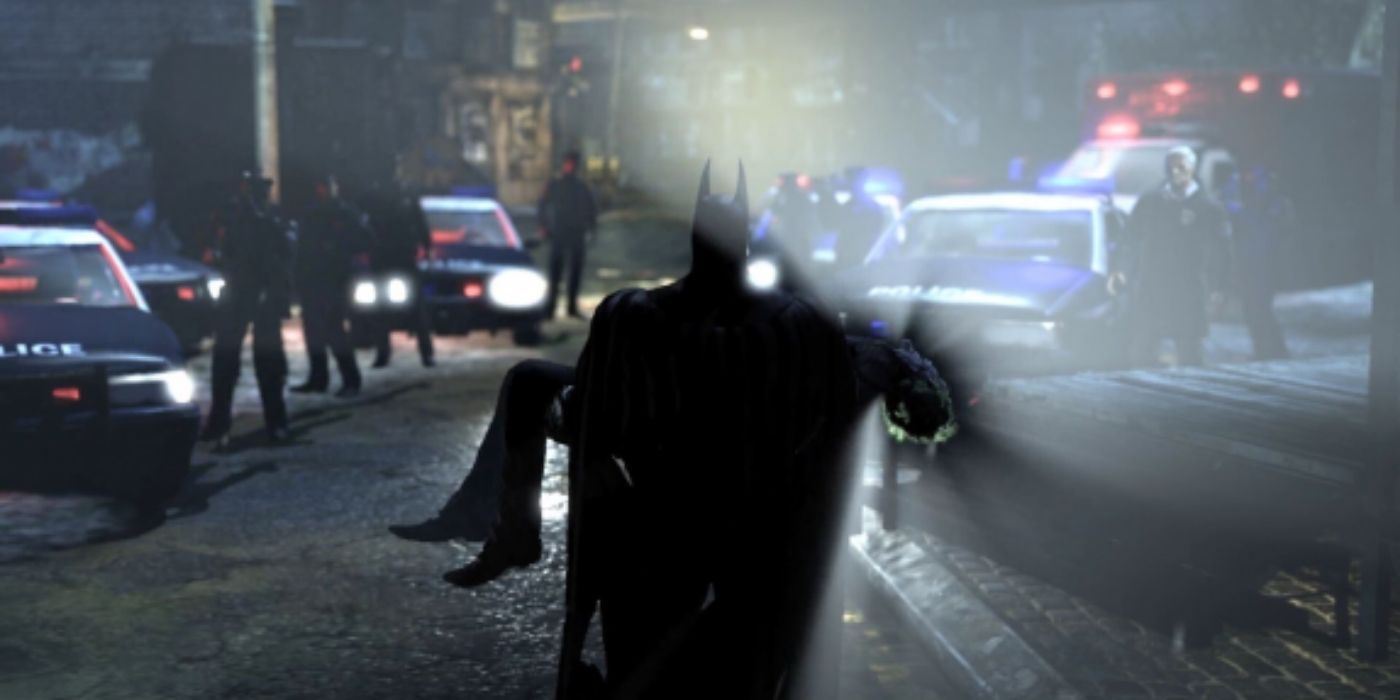 Batman carrying the Joker's body as seen from behind