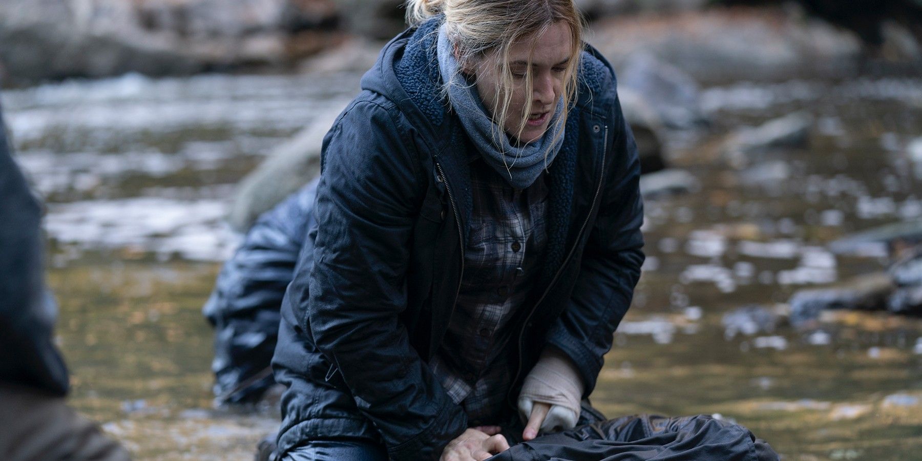 Kate Winslet as Mare Sheehan as she investigates a body in Mare of Easttown