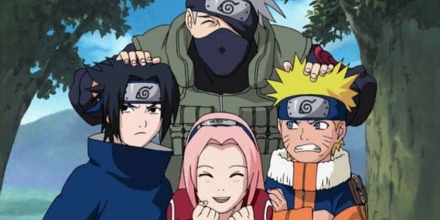 Sakura and Kakashi smile and Sasuke and Naruto are mad while posing for a photo