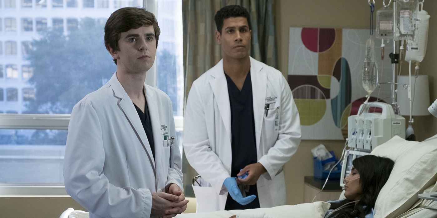 The Good Doctor's Shaun Murphy and Jared Kalu (Freddie Highmore, Chuku Modu) stand by a hospital bed