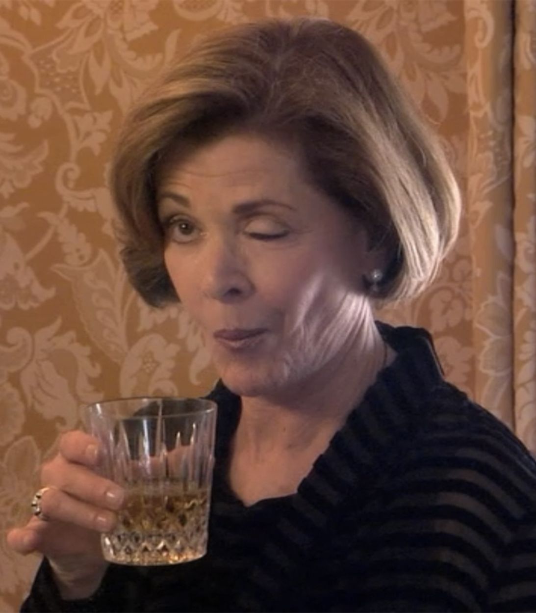 Lucille Bluth tries to wink