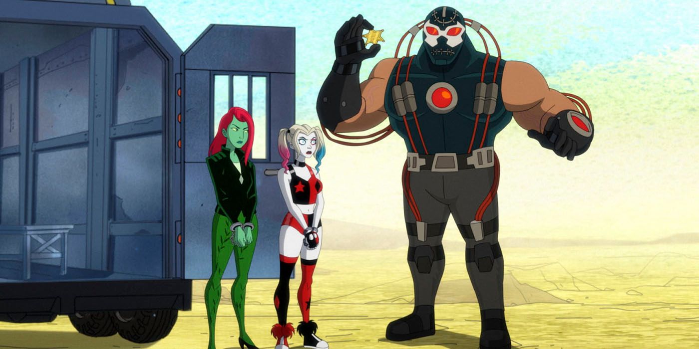 Harley Quinn and Poison Ivy stand next to a prison transport truck as Bain explains the Pit Prison to them. The Pit is a hole in the ground in front of them.