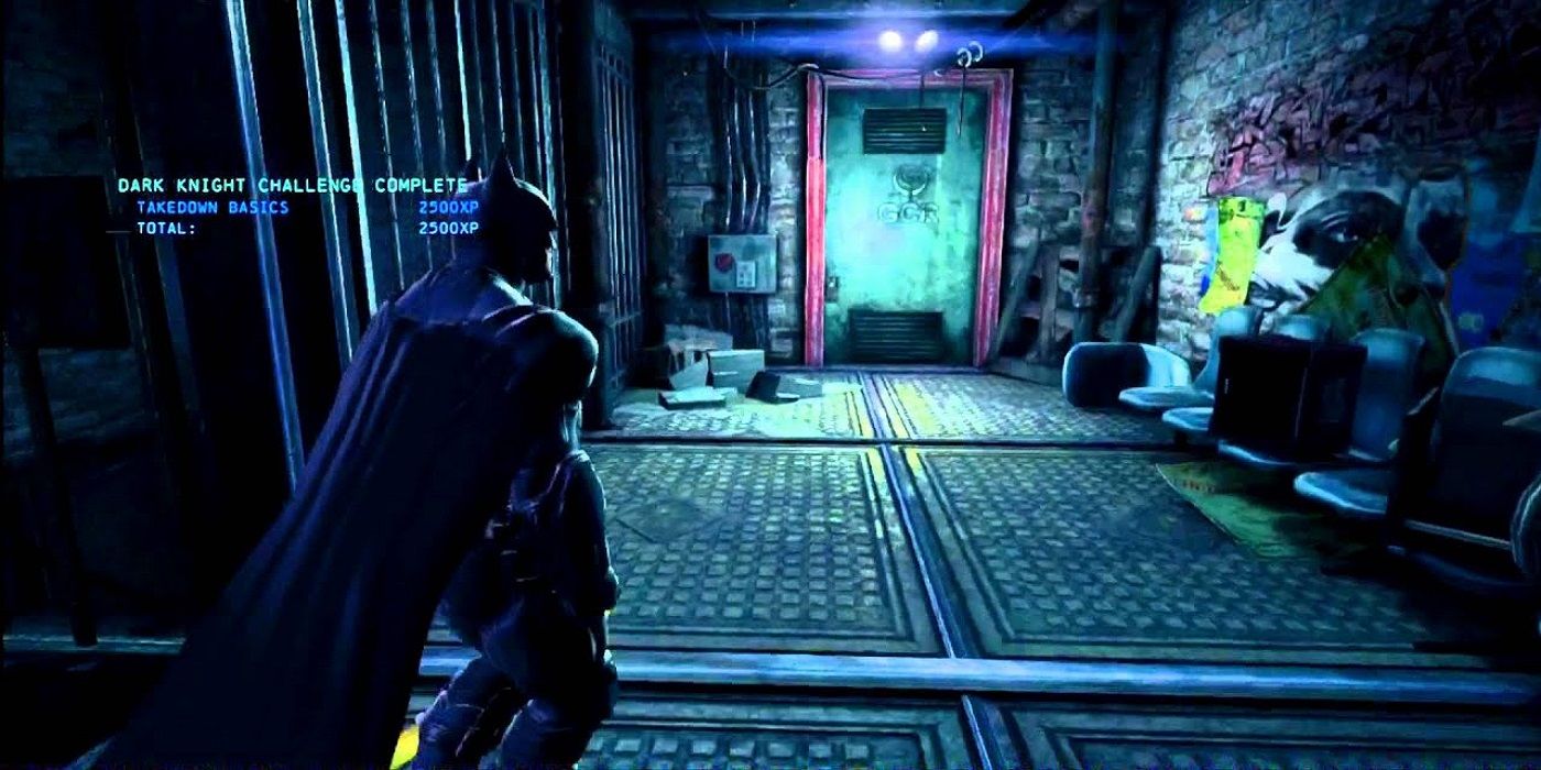 batman suverying a dark and empty warehouse room