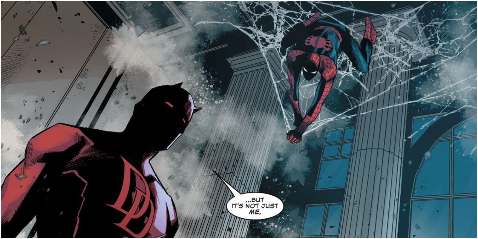 Spider-Man hanging in a web above Daredevil