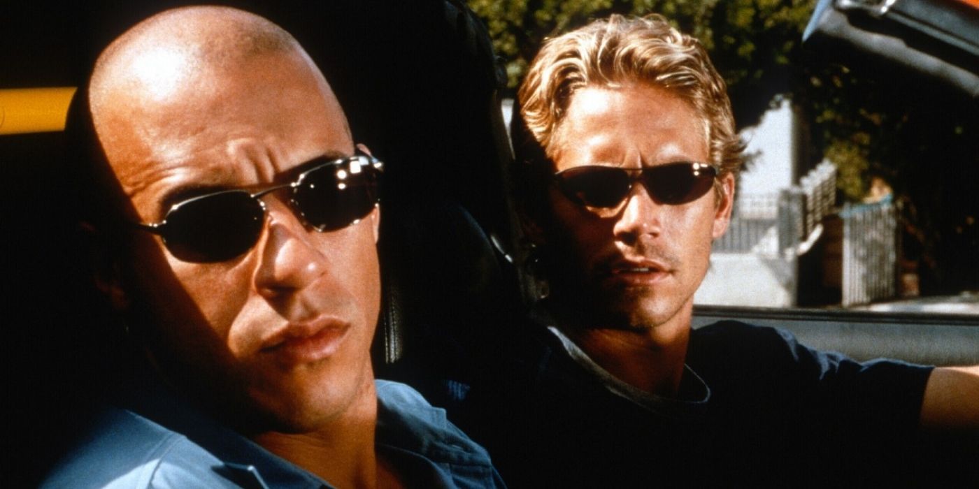 The Fast and the Furious: Dom and Brian occupying the front seats of a muscle car.