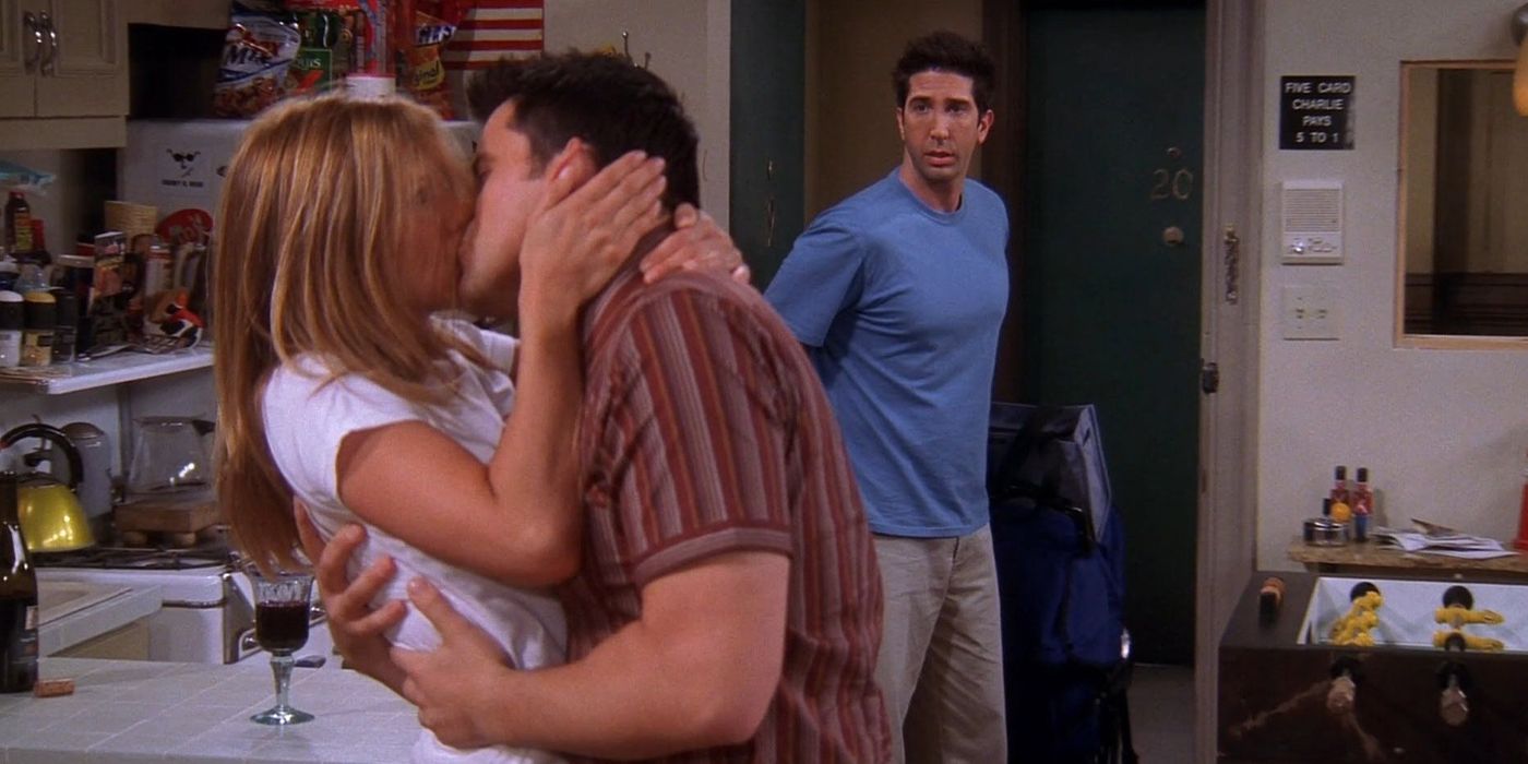 Rachel and Joey kiss in front of Ross in Friends
